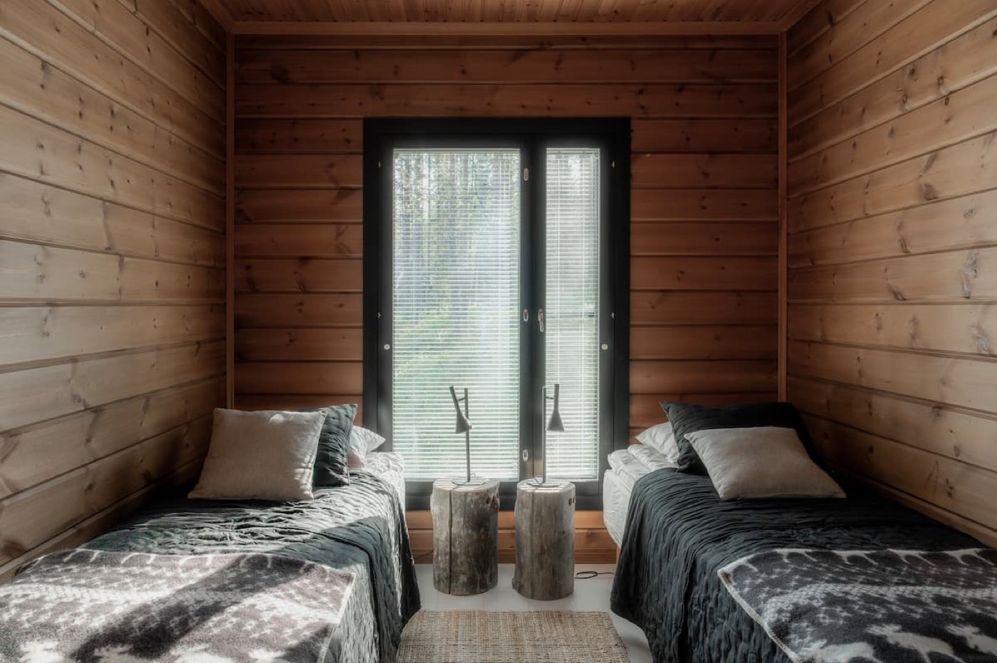Bedroom 2 with two single beds and a window between them