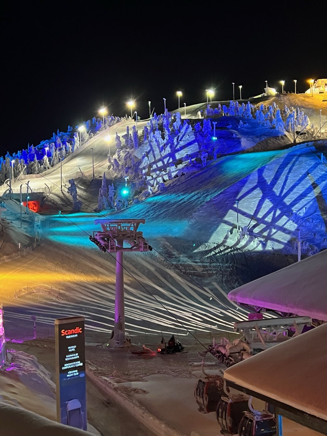 Chairlift and floodlit pistes at Ruka