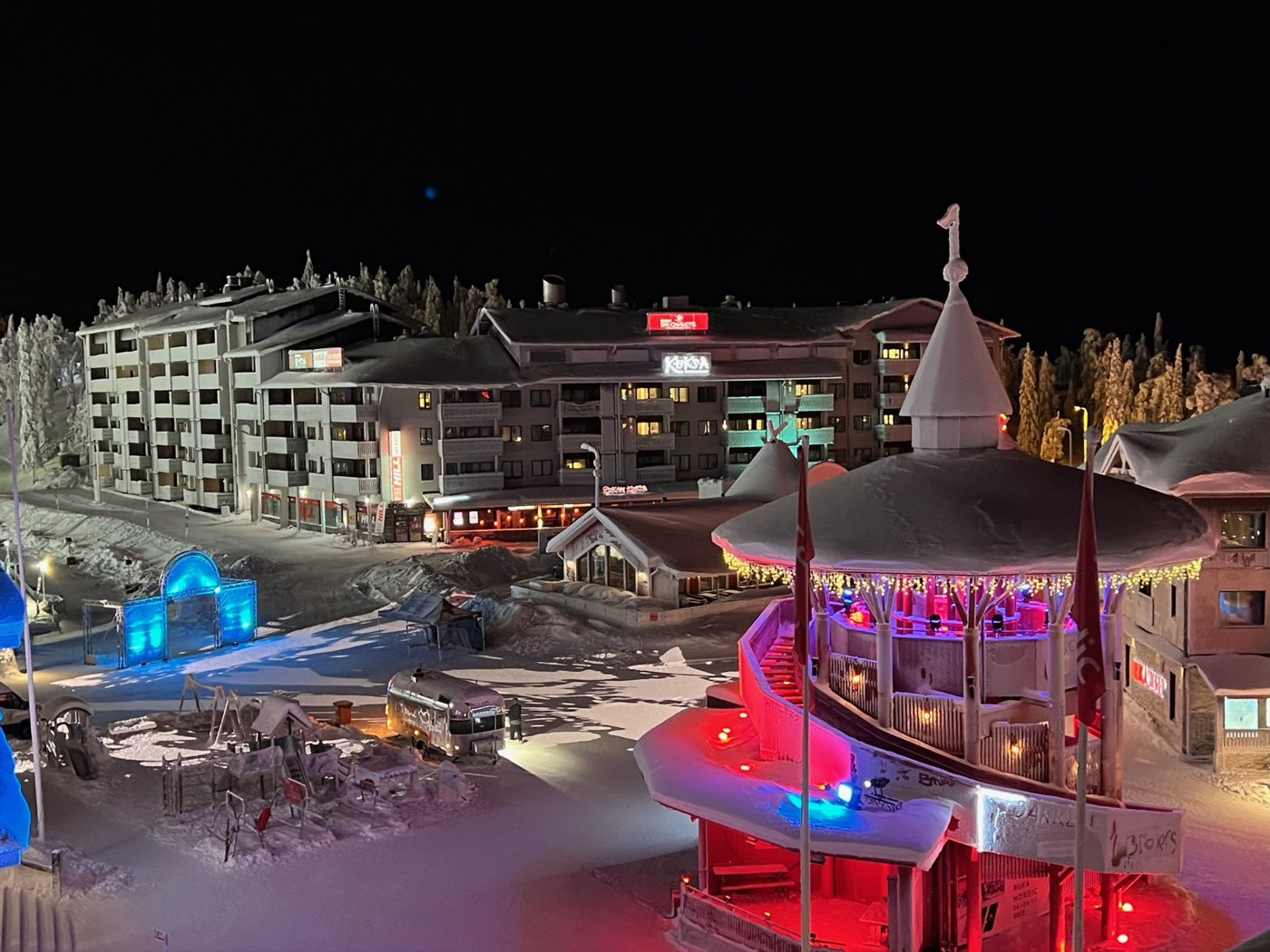 Ruka village square at night with lit pavilion